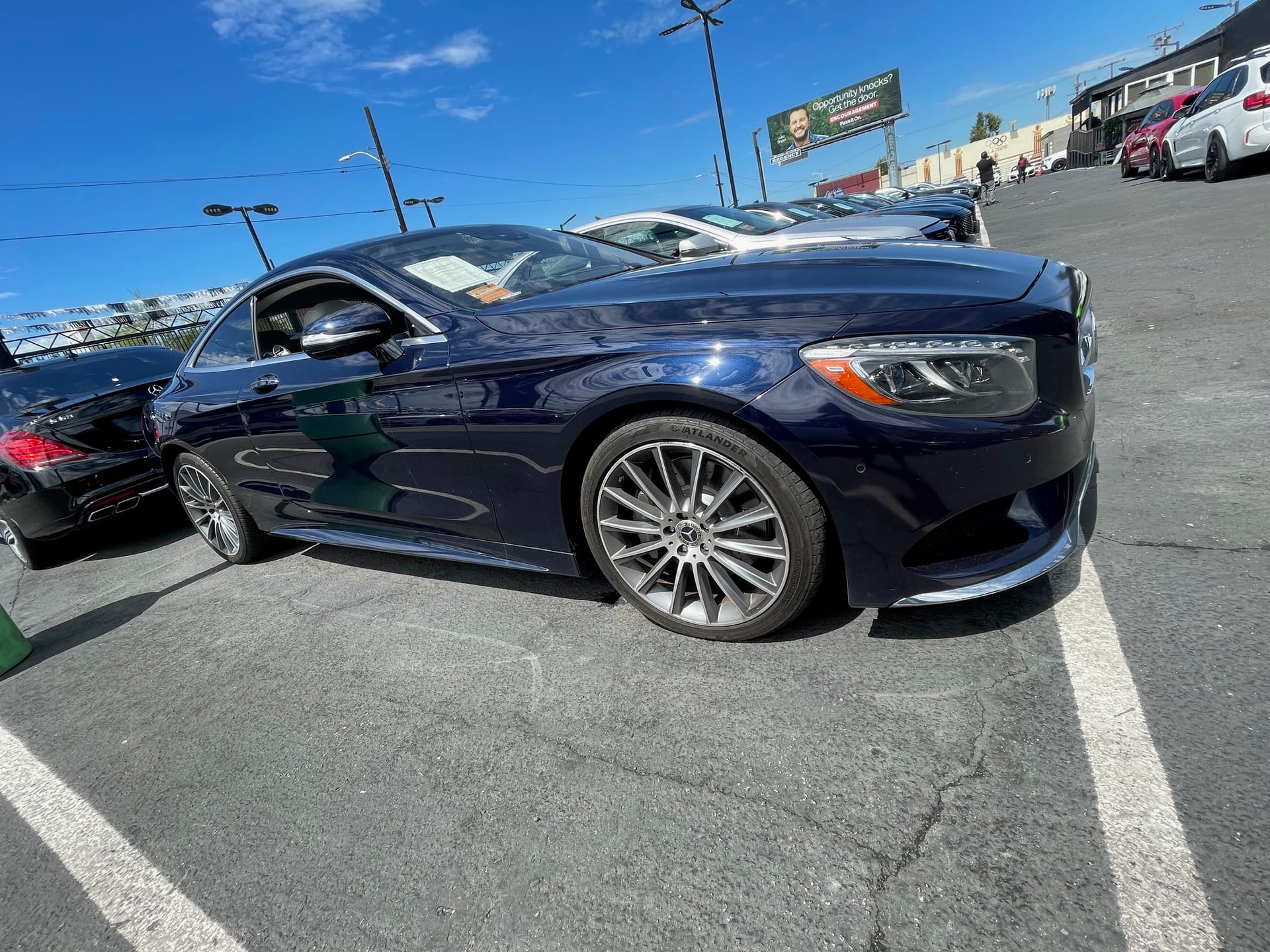Dark blue Mercedes-Benz S-Class coupe on a dealer lot