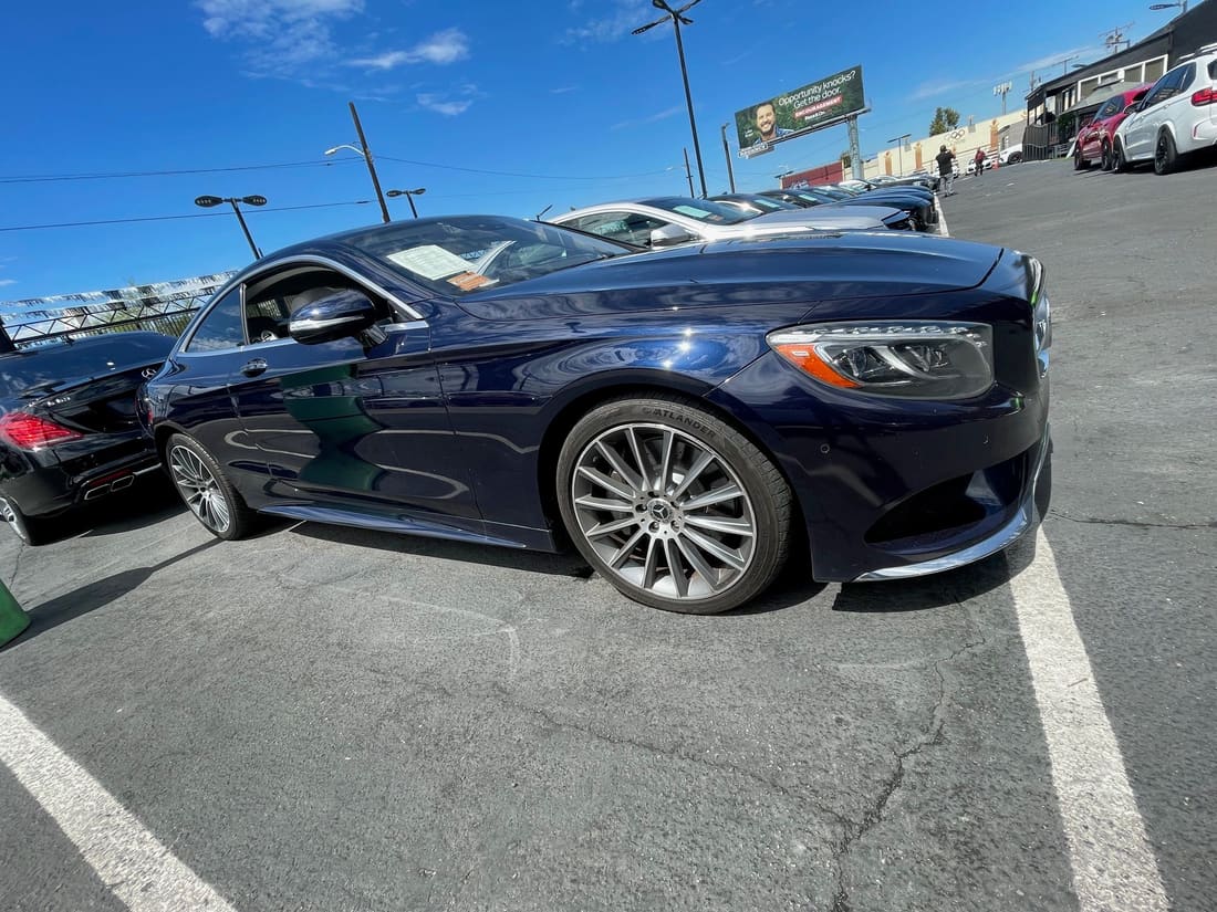 Side profile of a dark blue Mercedes-Benz S-Class coupe
