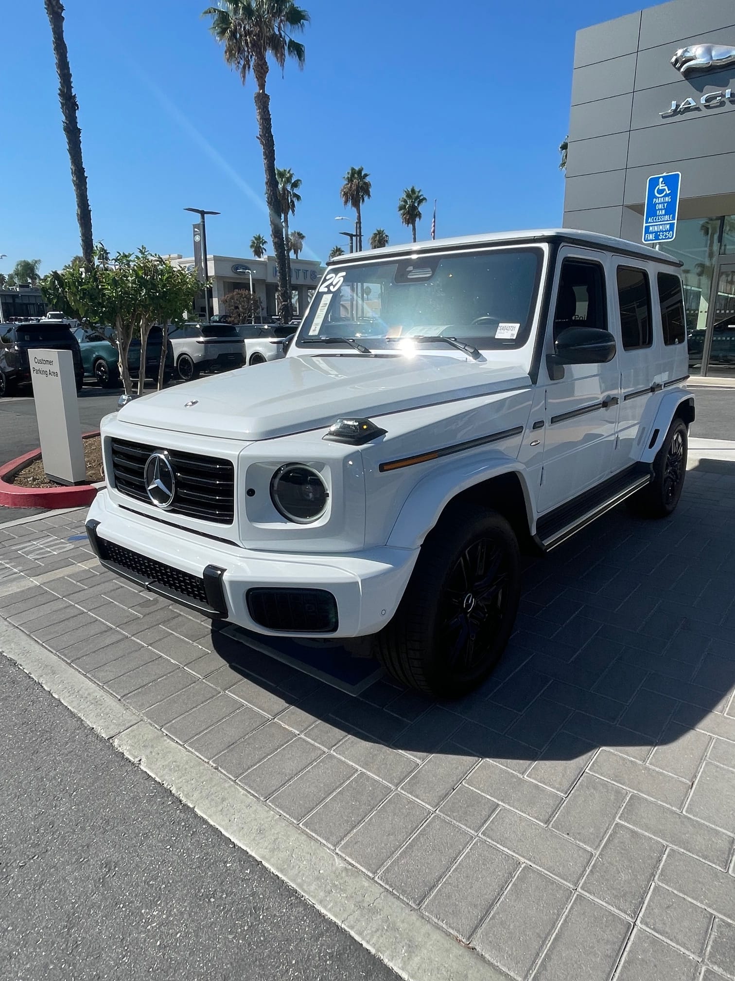 White Mercedes-Benz G-Class outside a dealership in Southern California